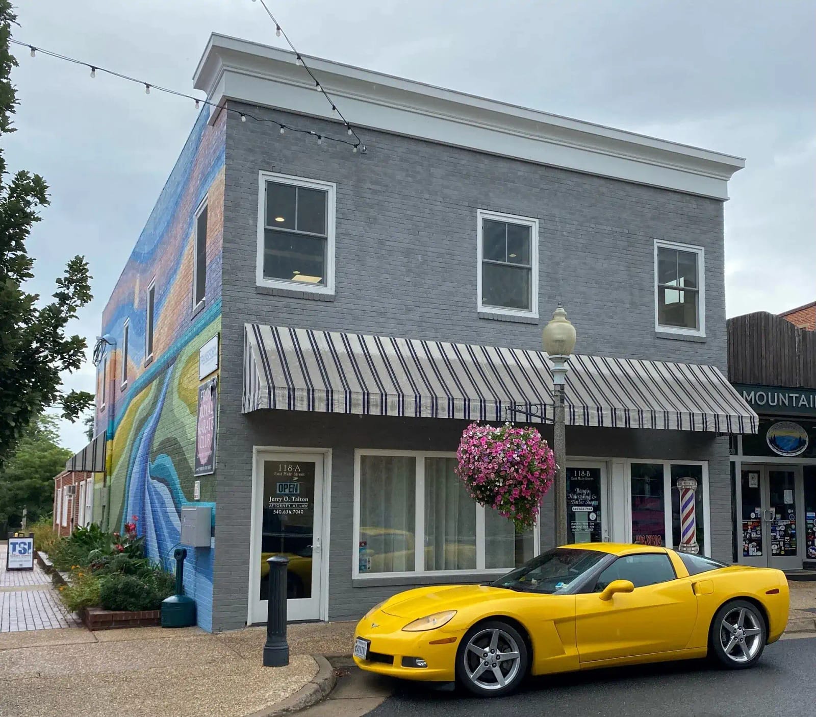 Jerry O. Talton's law office at 118A E Main St, Front Royal — gray brick storefront with striped awnings